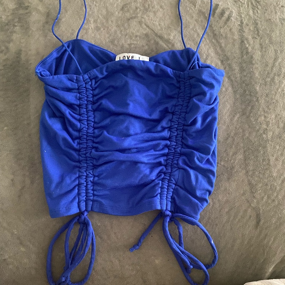 Spaghetti strapped crop tank, size medium, it’s a dark blue color.